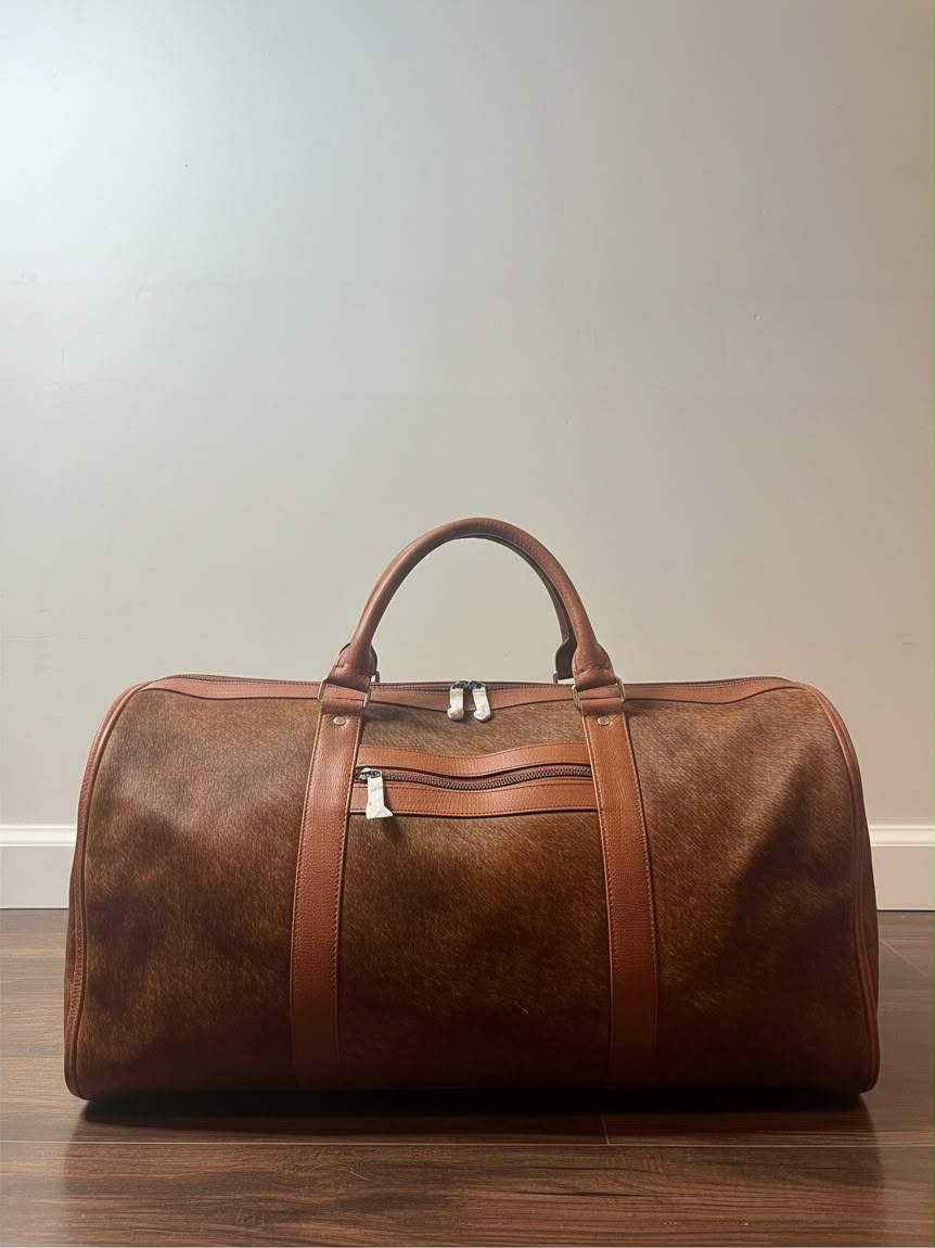 Brown real cowhide leather weekender bag with handles and front zip pocket