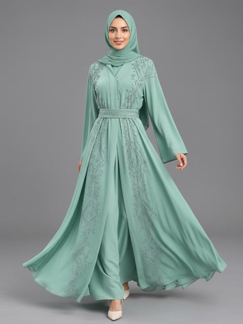 Woman wearing the Celeste embellished belted abaya in dusty rose