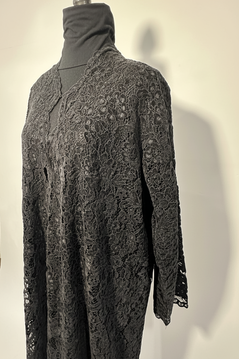 Black lace abaya close detail, white background
